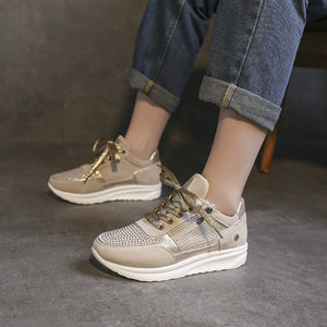 Khaki rhinestone embellished lace-up sneakers with chunky soles and gold accents.
