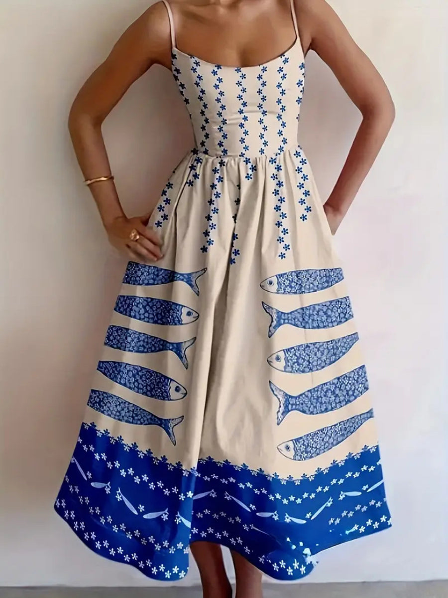Spaghetti strap midi dress in cream with blue sardine and floral print.