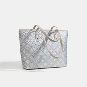 tote in pale lavender with geometric and tassel charm
