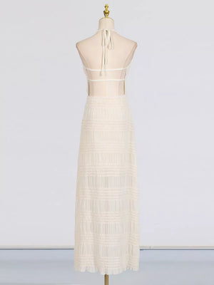 Textured halter neck maxi dress in ivory with sheer back and tiered skirt.