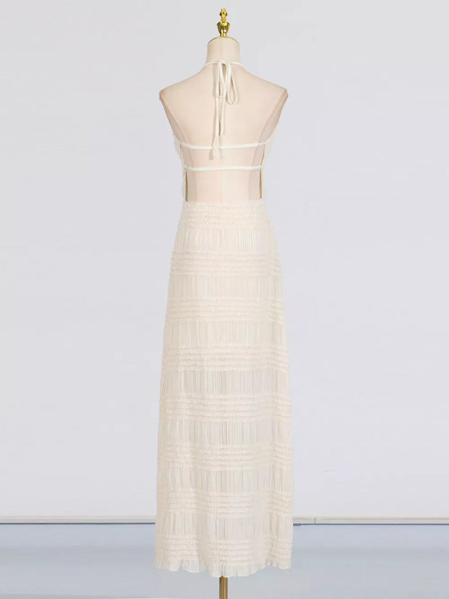 Textured halter neck maxi dress in ivory with sheer back and tiered skirt.