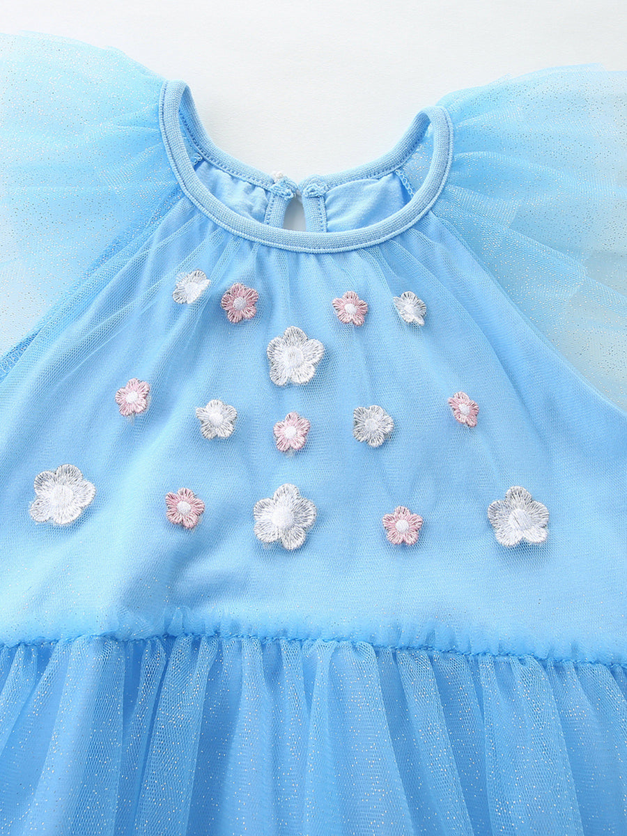 Blue tulle baby dress with cap sleeves and floral embroidery detail.