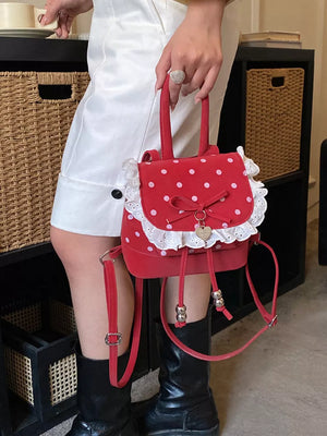 backpack in red with lace trim and mini