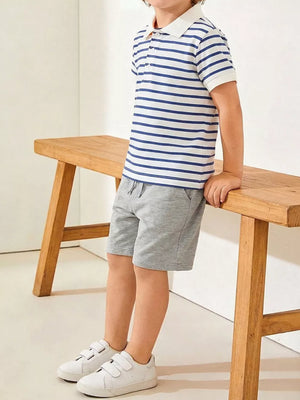Boys' blue and white striped polo shirt and grey cotton shorts ensemble.