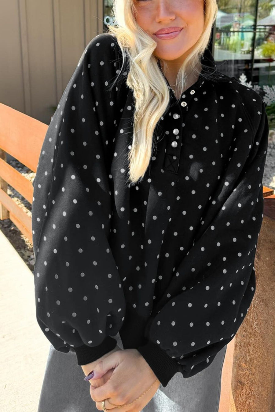 100% polyester Care instructions: Machine wash cold sweatshirt in Black with relaxed silhouette