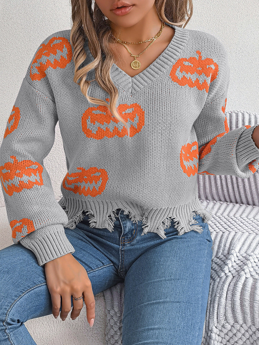 orange pullover sweater featuring raw hem and pumpkin