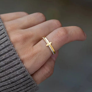 clear ring featuring cross motif and geometric