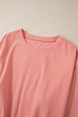 Pink ribbed crewneck sweater with long sleeves