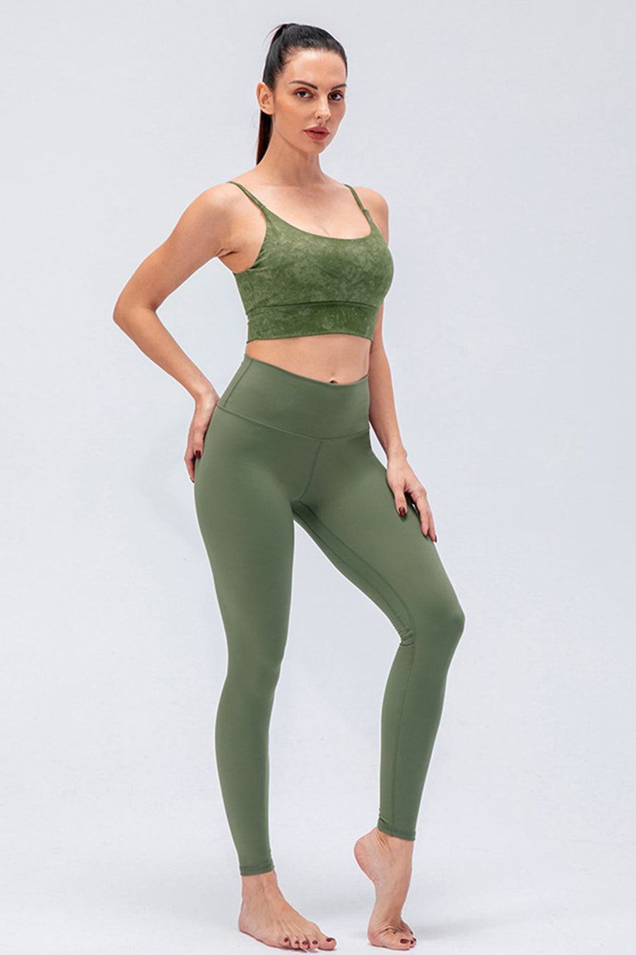 Sculpted olive high-rise performance leggings with a seamless design and full length.