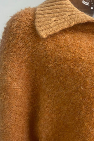 Textured bouclé collar cardigan in tangerine acrylic with a ribbed collar detail.