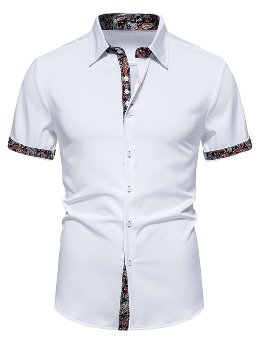 White short sleeve buttoned shirt with paisley trim on collar, cuffs, and placket.