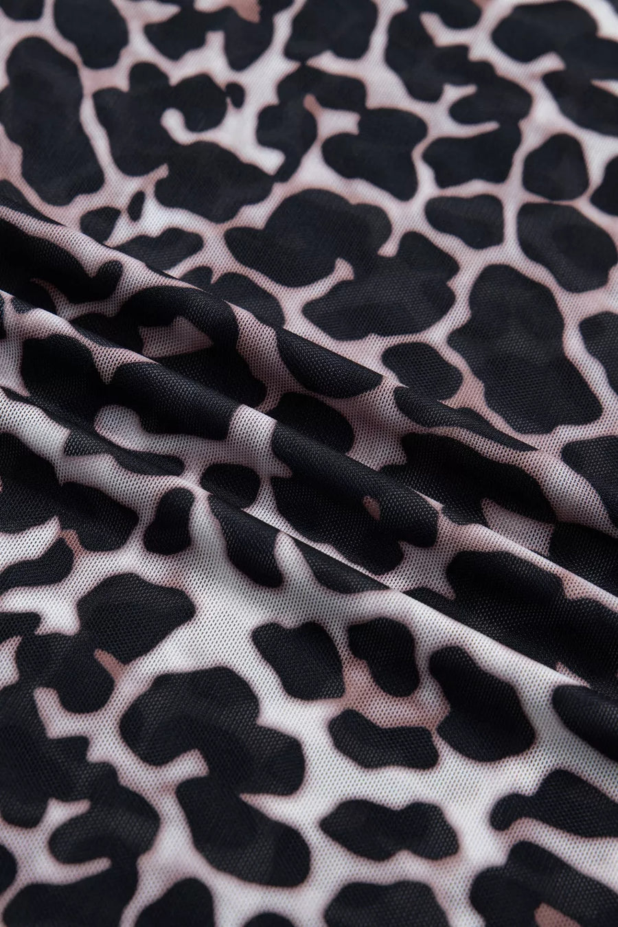 Leopard print sheer mesh t-shirt with a lightweight, see-through texture.