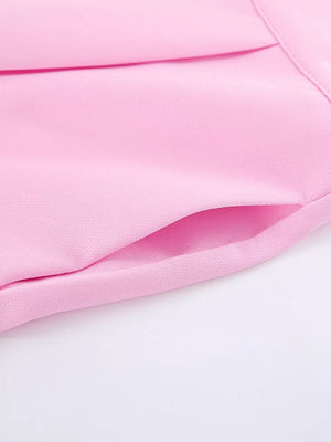 two-piece set in light pink with buttoned and hip-length top, full-length bottom