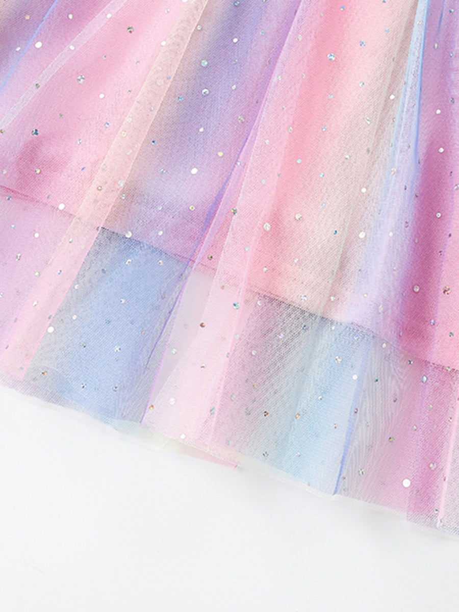 Unicorn dress with rainbow ombre tulle and glitter accents.
