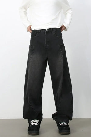 Black denim baggy trousers with a relaxed fit and unique pocket details.