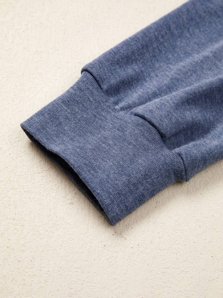 Blue heather knit raglan shirt sleeve cuff detail