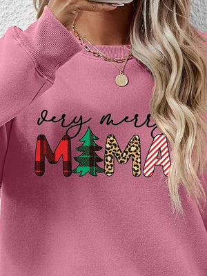 Blush pink long sleeve sweater with "Very Merry Mama" graphic in plaid, tree, leopard, and stripe patterns.