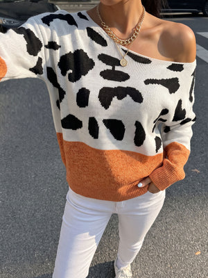 black pullover sweater featuring off-shoulder and cow-print