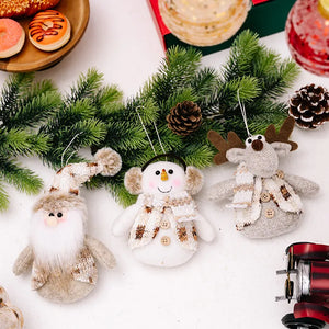 Festive Trio knitted ornaments: Santa, snowman, and reindeer with cozy scarves and hats.