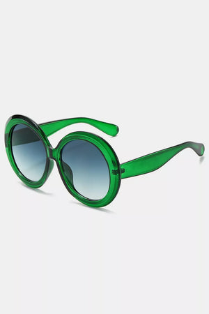 Chic oversized round green fashion sunglasses with gradient lenses.