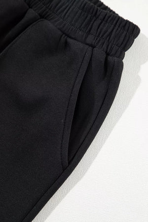 50% polyester, 45% viscose, 5% elastane Care instructions: Machine wash cold sweatshirt and sweatpants set in black with