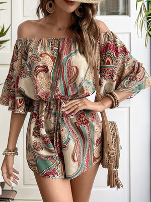 Paisley print off-the-shoulder romper with drawstring waist and flutter sleeves.