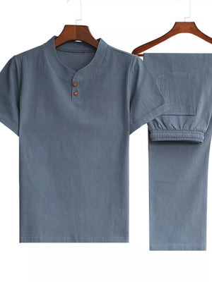 Men's casual two-piece set in light gray with band collar and drawstring pants.