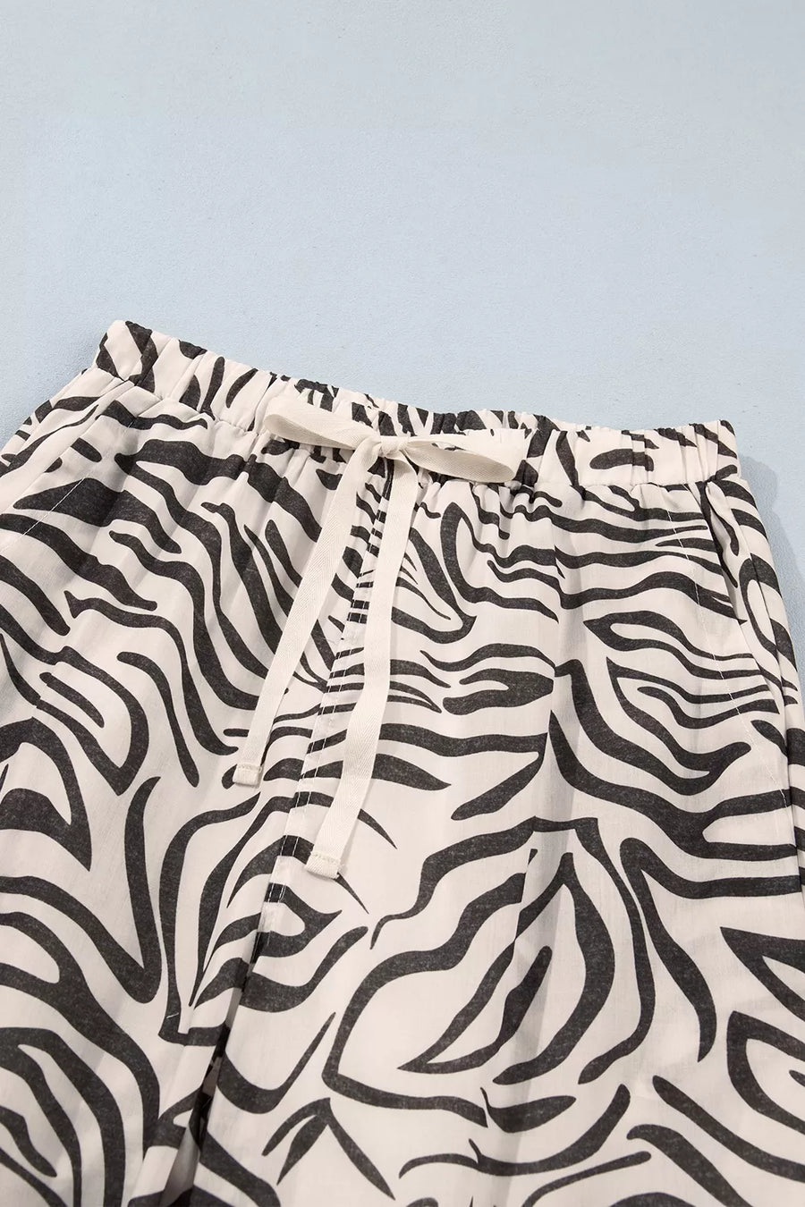 wide-leg pants in ivory with drawstring and ankle-length