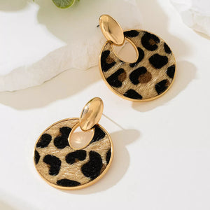 black earrings featuring dangle and leopard-print