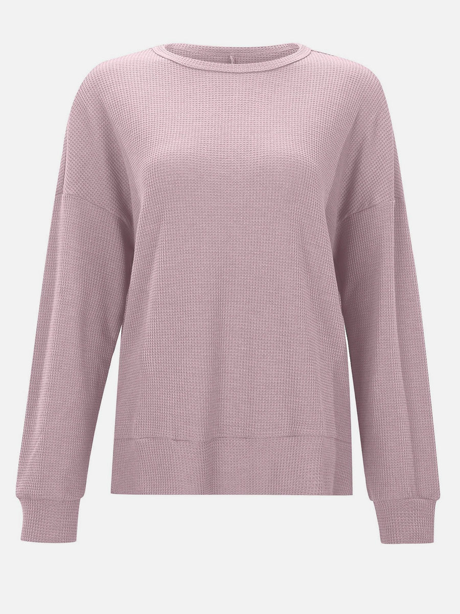 Dusty Pink waffle knit relaxed fit crewneck top with long sleeves and ribbed cuffs and hem.