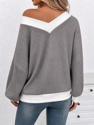 95% polyester, 5% elastane Care instructions: Machine wash cold v-neck sweater in white with relaxed silhouette