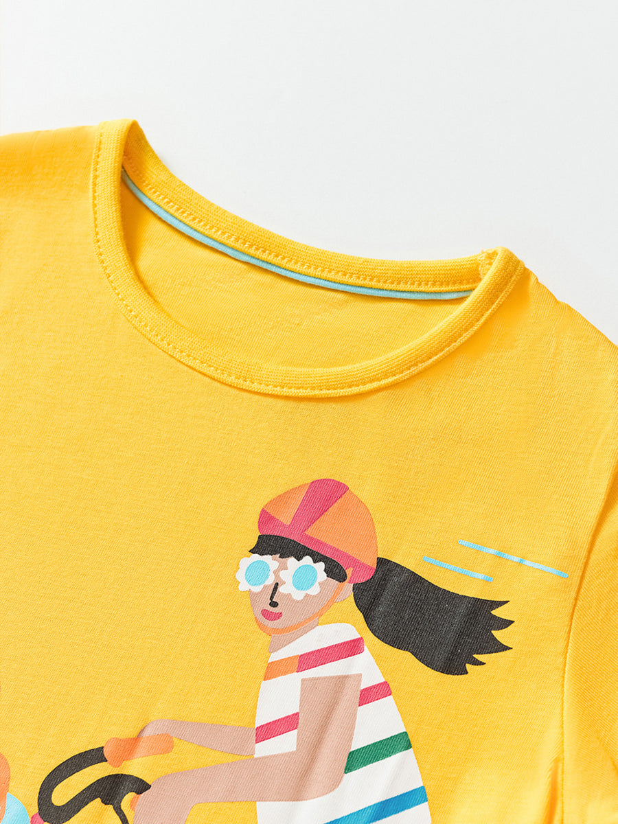 Yellow cotton crew neck t-shirt with a graphic of a girl riding a bicycle.