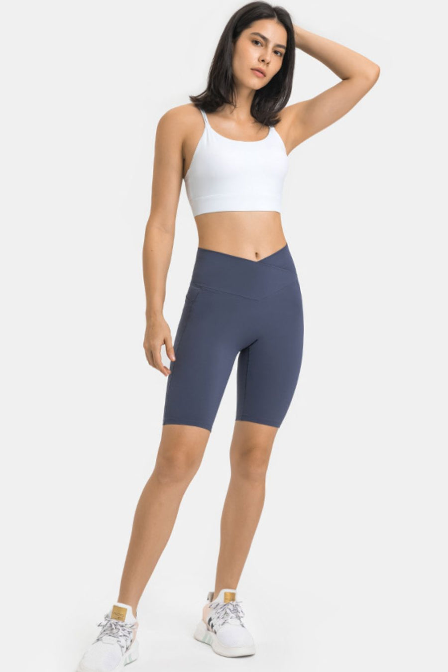 V-Waist pocketed performance biker shorts in Steel blue, with side pockets and a V-shaped waistband.