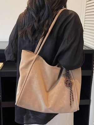 Large camel suede shoulder bag with braided rope charm detail