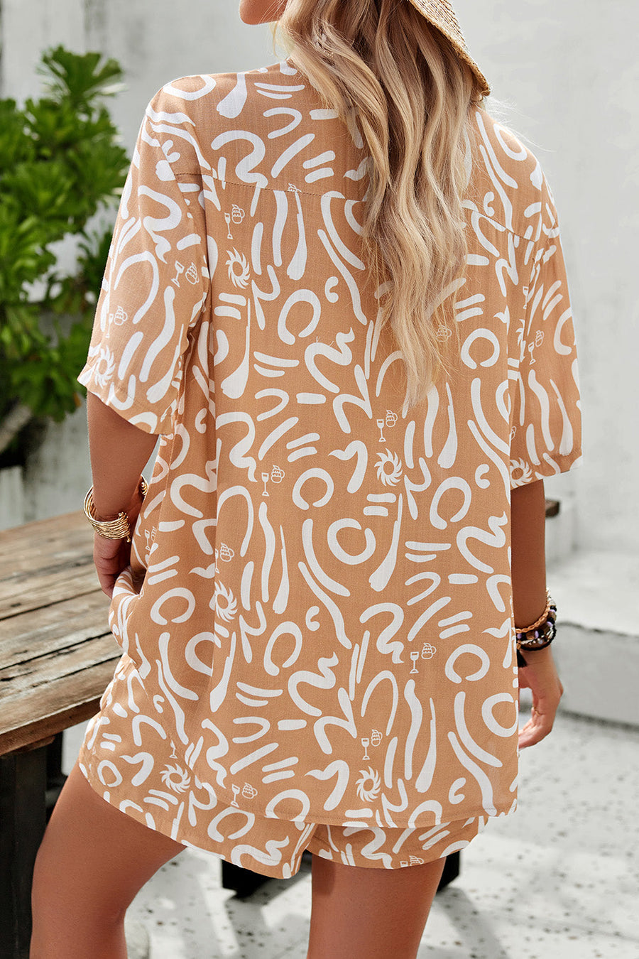 Women's resort shirt in caramel with abstract white print, short sleeves, button-down style