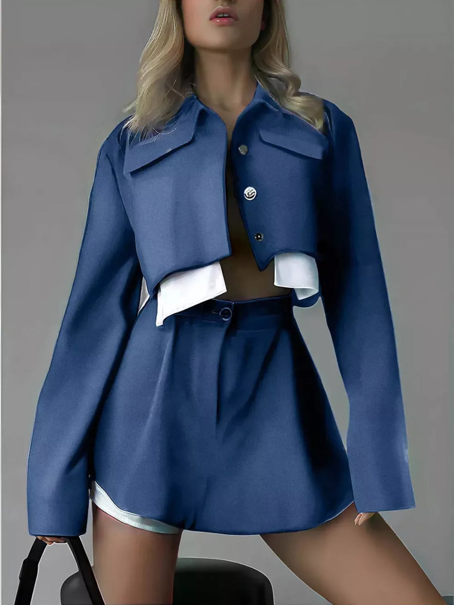 matching set in navy blue featuring cropped jacket and boxy fit
