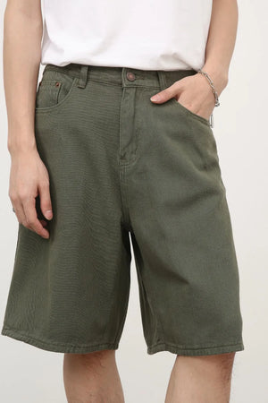 Textured denim Bermuda shorts in Army Green with a casual fit.
