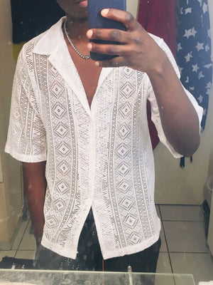 White crochet button-up shirt with geometric pattern and short sleeves.