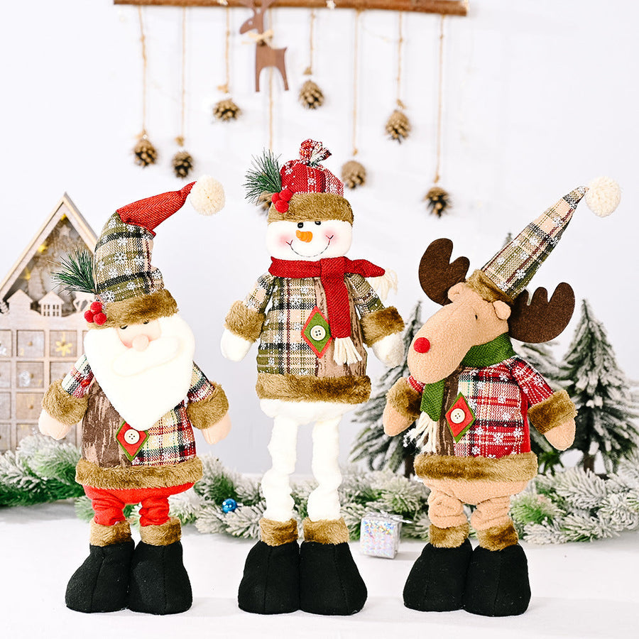 Festive Plaid Character Trio: Santa, Snowman, and Reindeer plush figures with red, green, and brown plaid patterns.