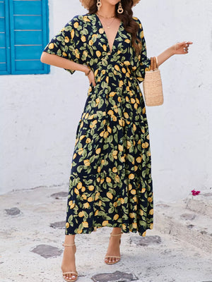 Lemon Leaf Print V-neck Midi Dress in Black Forest cotton blend with tiered skirt and flutter sleeves.
