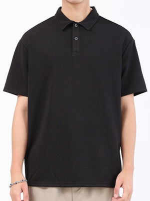 Black textured performance polo shirt with short sleeves and a two-button placket.
