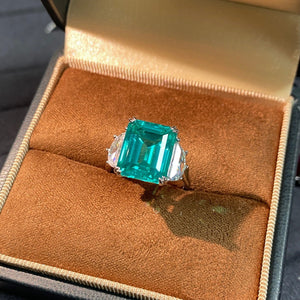 silver ring featuring zircon stones and geometric