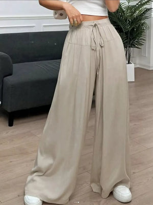 wide-leg pants in light beige featuring drawstring waist and wide-leg fit
