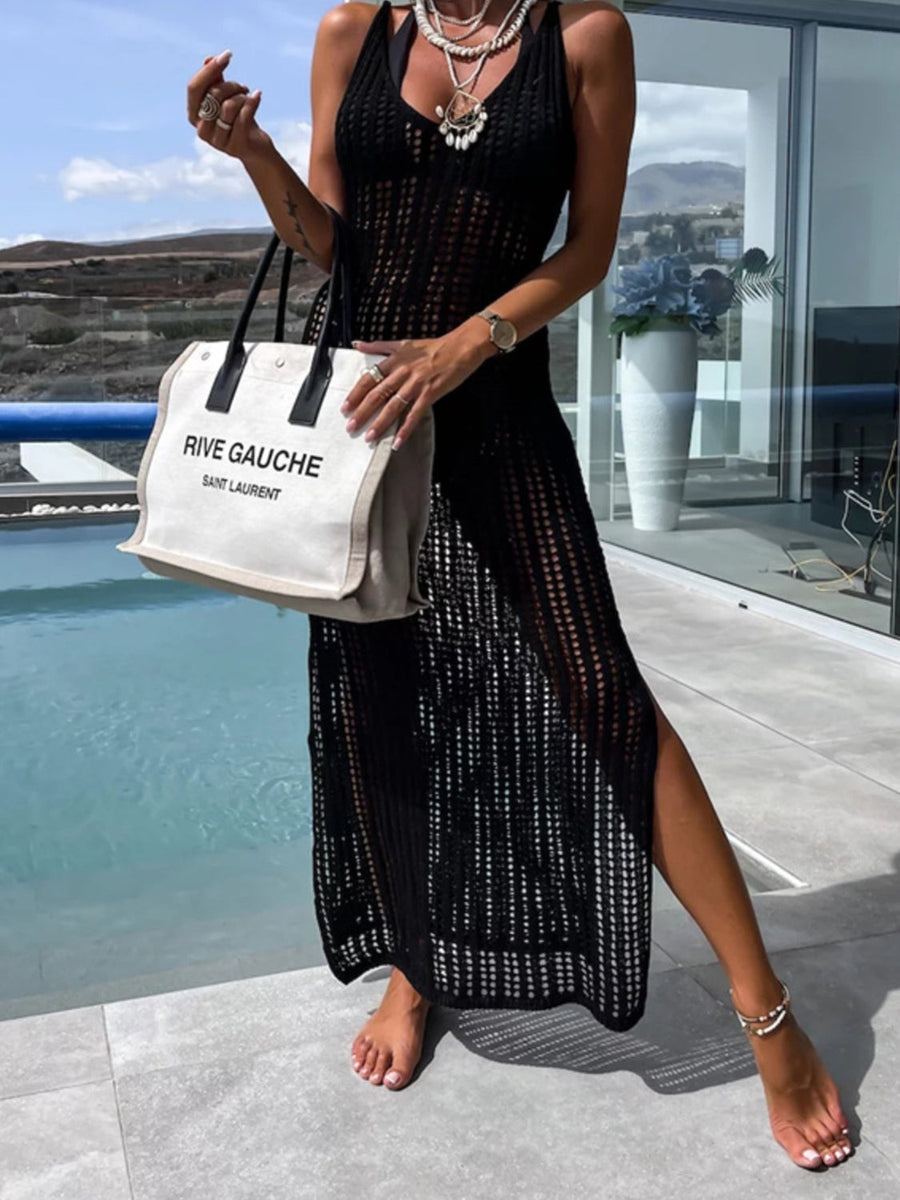 Black open-knit maxi cover-up with slit front and V-neck, styled with a tote bag.