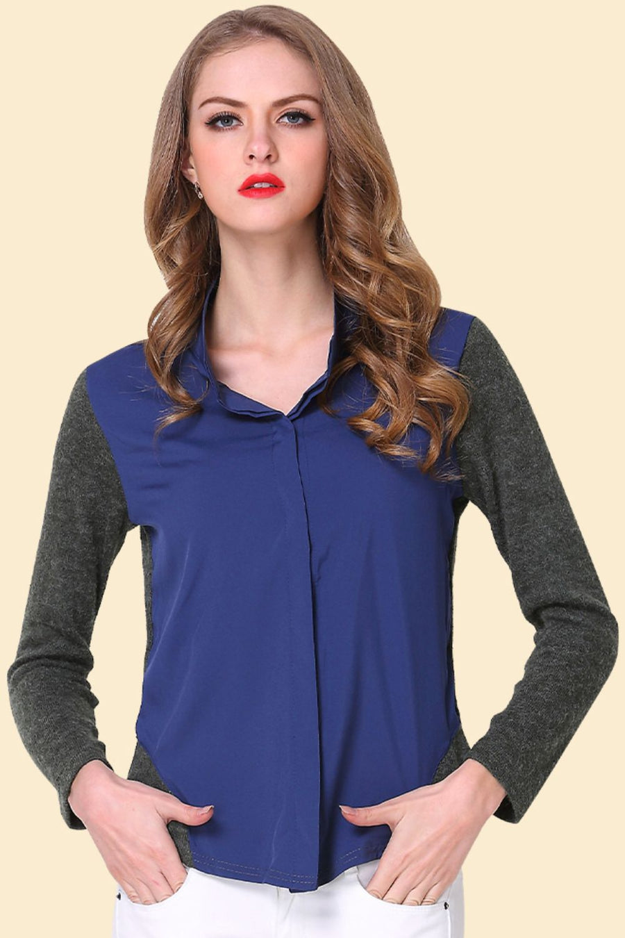 Colorblock knit sleeve blouse in dark blue with a pointed collar and button front.