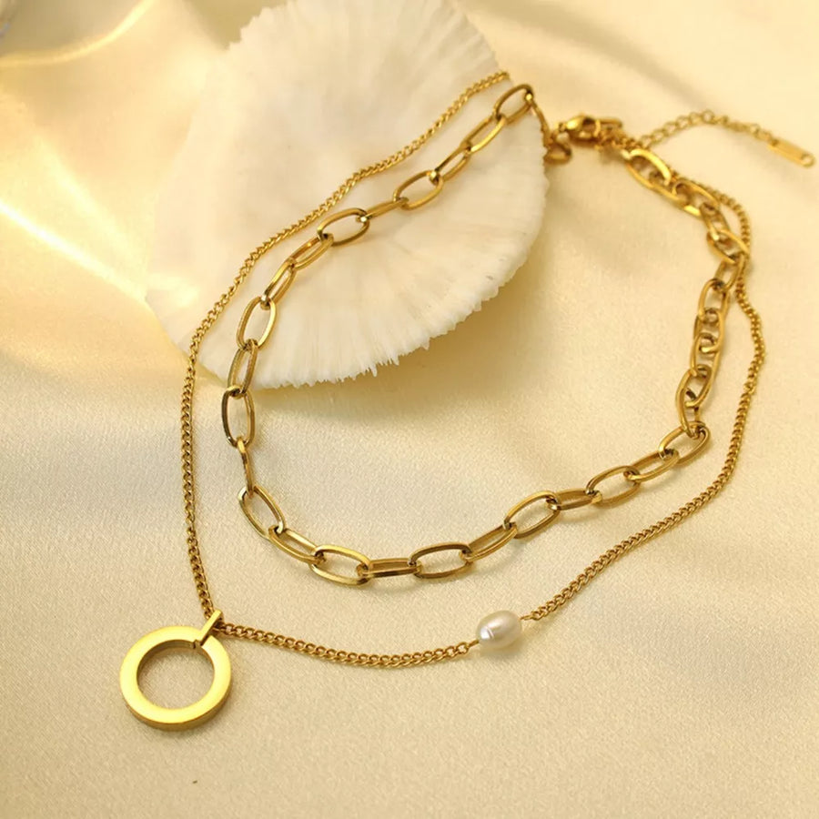 Synthetic Pearl,18K Gold-Plated,Stainless Steel Care instructions: Avoid wearing necklace in Gold with layered silhouette