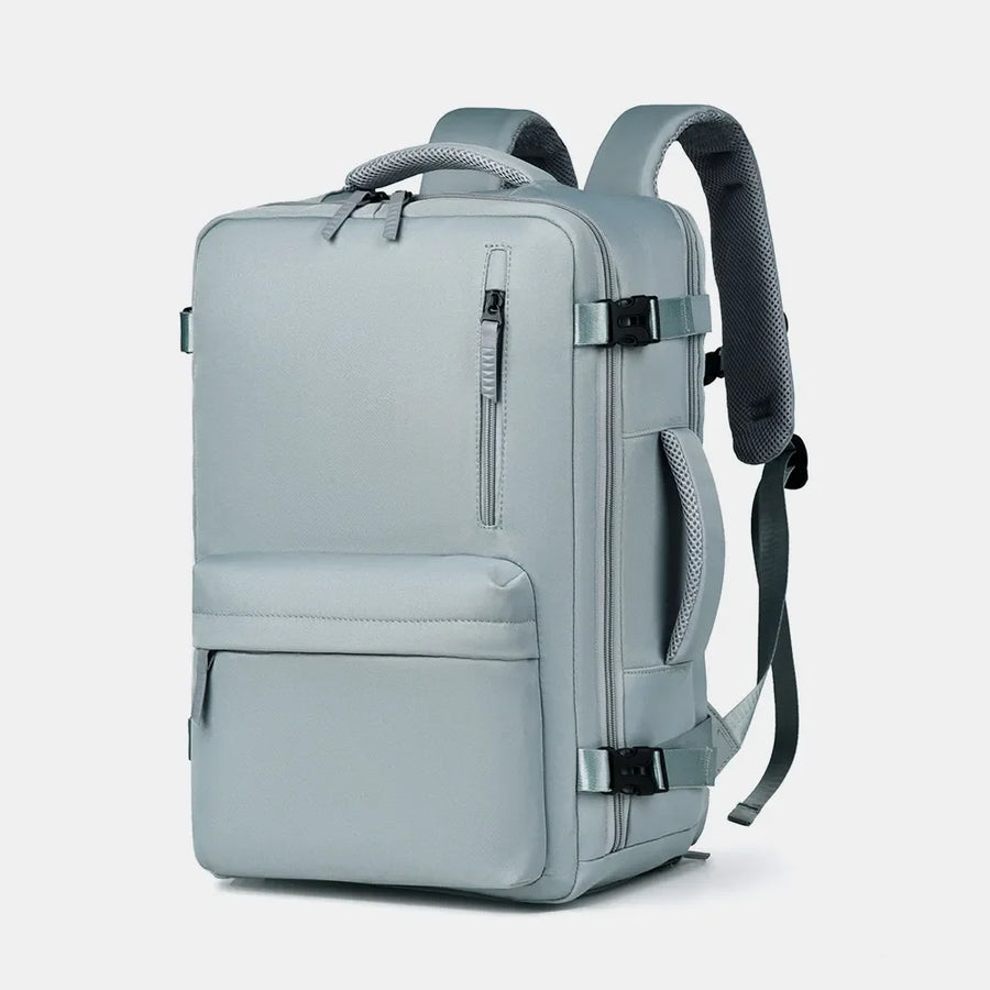 Travel backpack in beige with zippered front pocket and padded straps.
