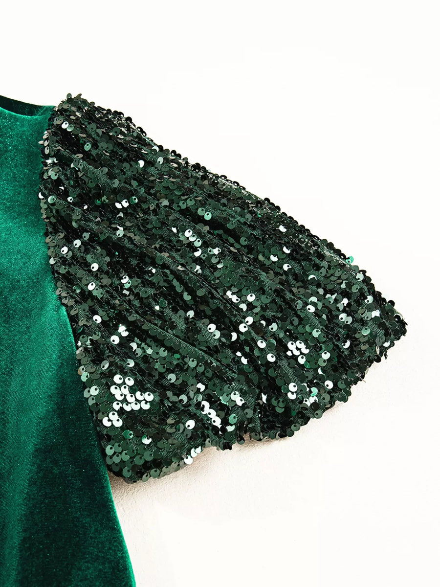Dark green velvet mini dress with sequin puff sleeves.