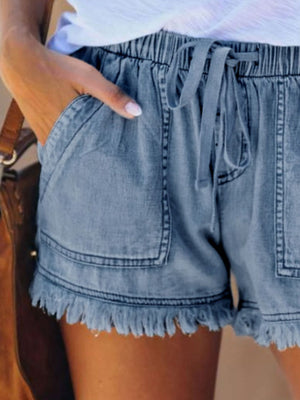 denim shorts in Dark Blue with raw hem and mini