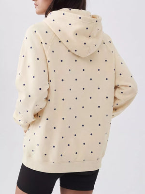 navy blue pullover hoodie featuring pocketed and polka dot